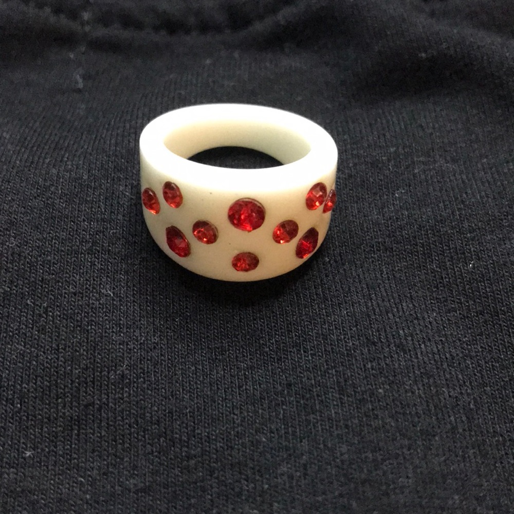 plastic ring with ruby gems
